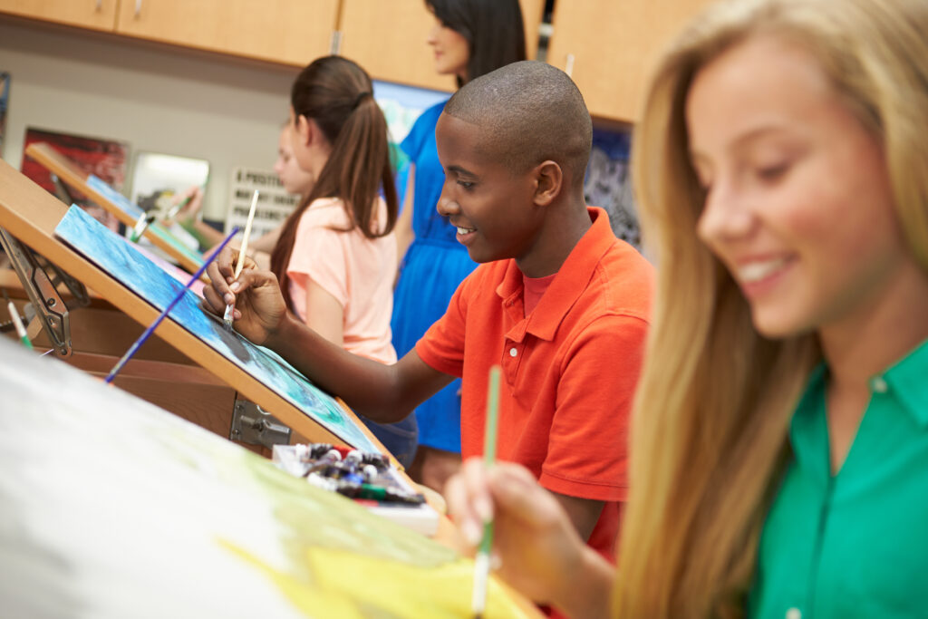 Teenagers painting