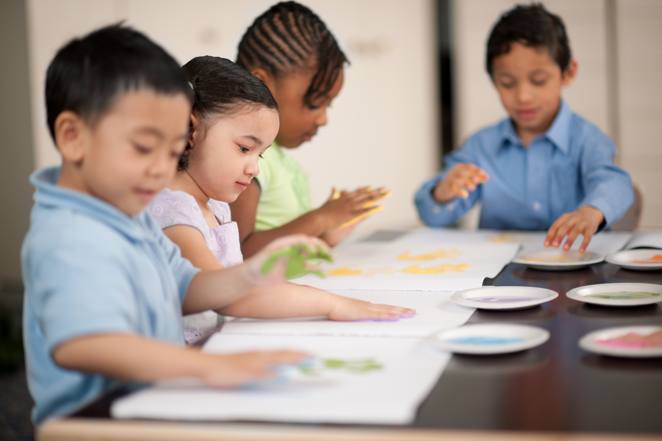 Pre-schoolers fingerpainting